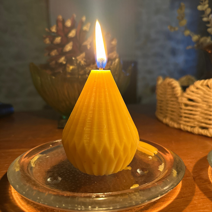 Handcrafted pear-shaped beeswax candle made from pure British beeswax with geometric origami design, by Gwenyn Gruffydd.