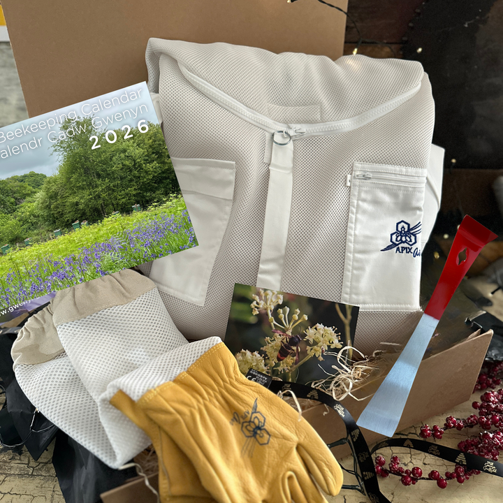 Beginner Beekeeper Gift Set with vented beesuit, gloves, hive tool, and 2026 beekeeping calendar in luxury Gwenyn Gruffydd gift box.